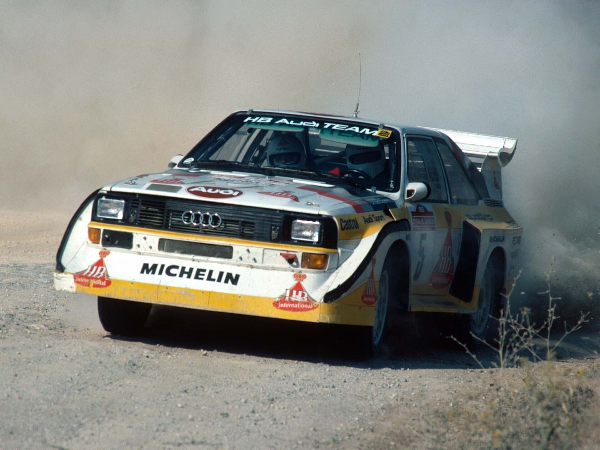 A picture showing an Audi Sport quattro S1 E2 rally car on gravel in Italy in 1985.
