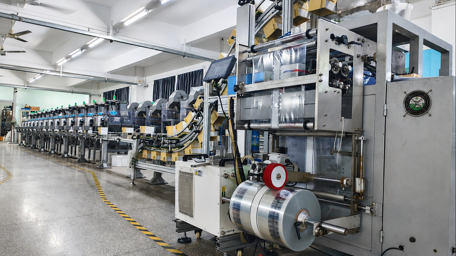 Packaging-film printing equipment, material rolls, and conveyor lines